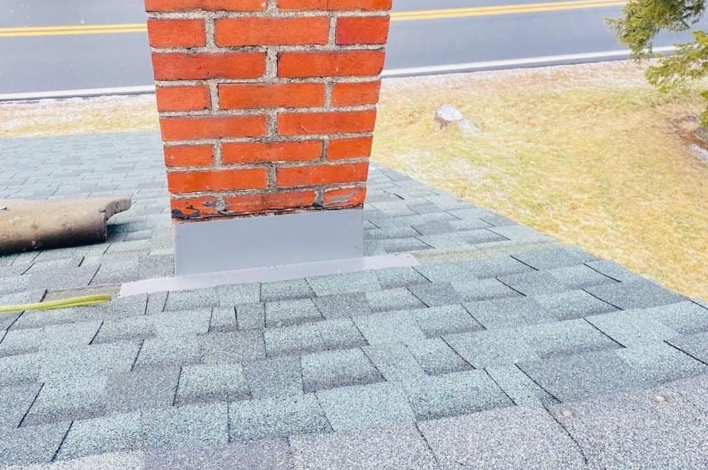 Chimney flashing repair on a shingle roof in Reading, PA