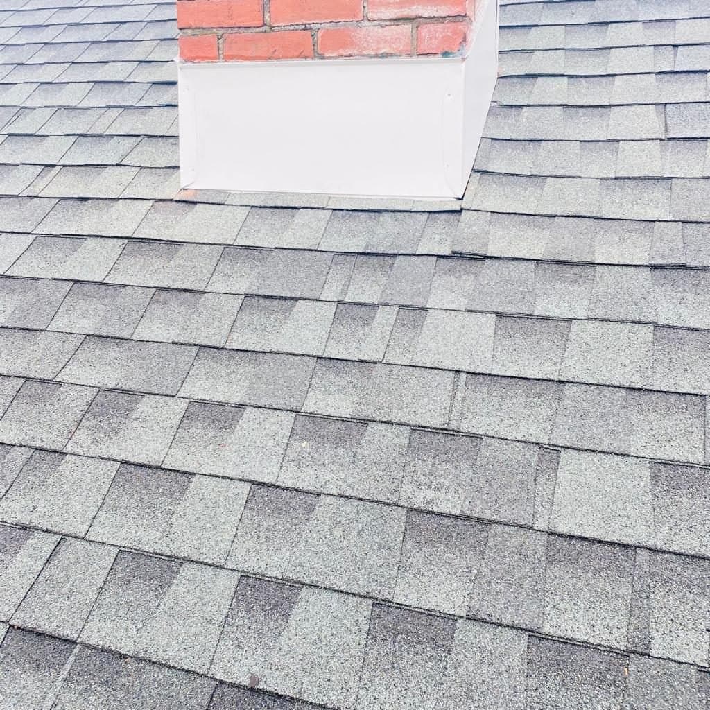 Brick chimney with new flashing and shingles, Berks County