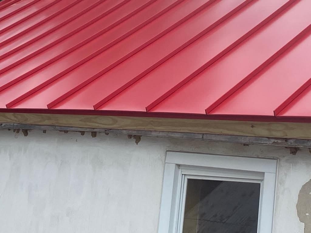 Metal roofing panel and trim detail